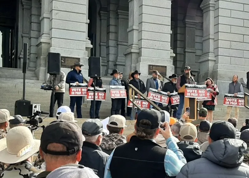 Hunters gather outside the Captitol Building in Denver, Colorado to oppose Proposition 127.