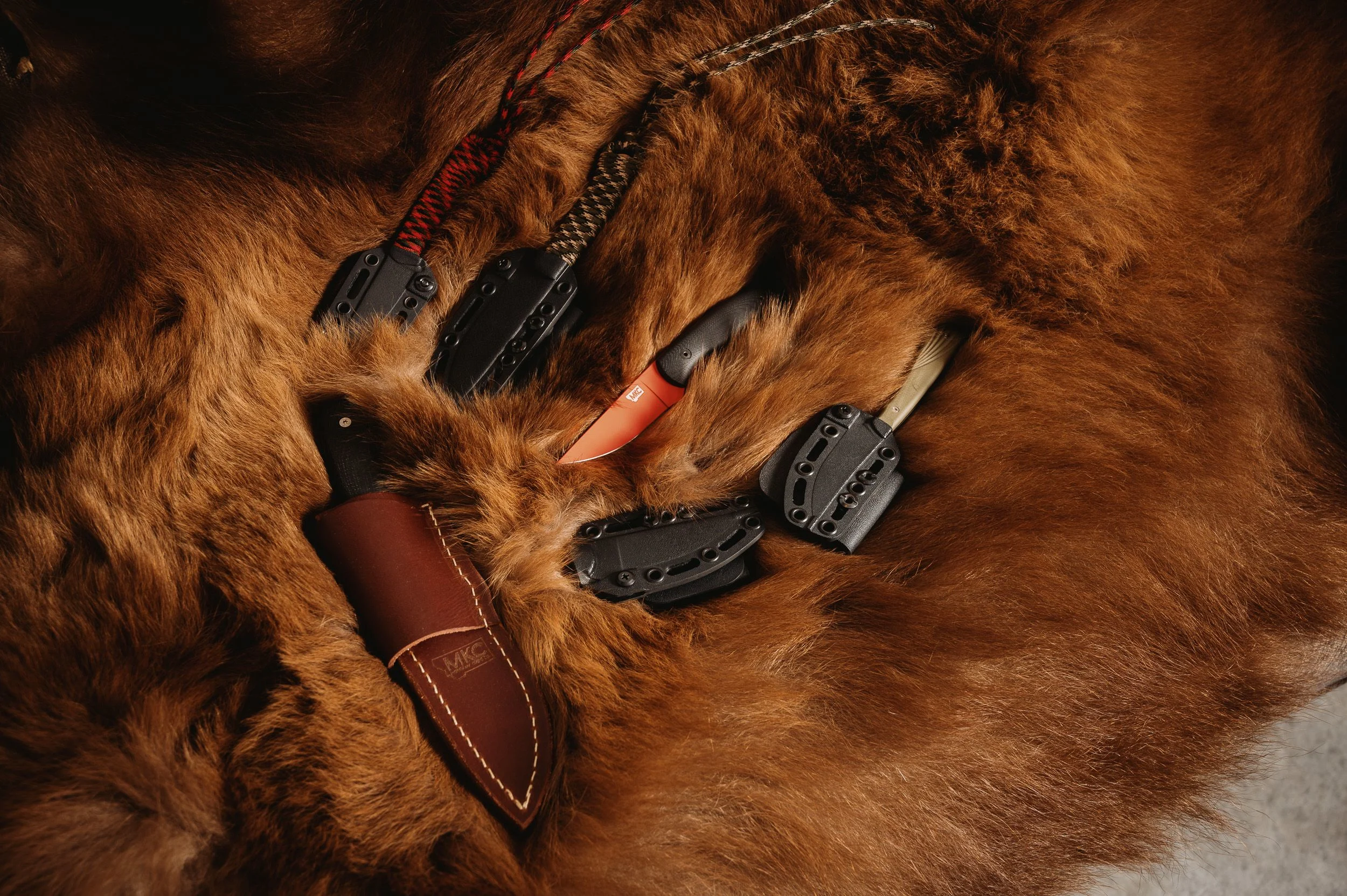 Knives displayed on an elk hide. 