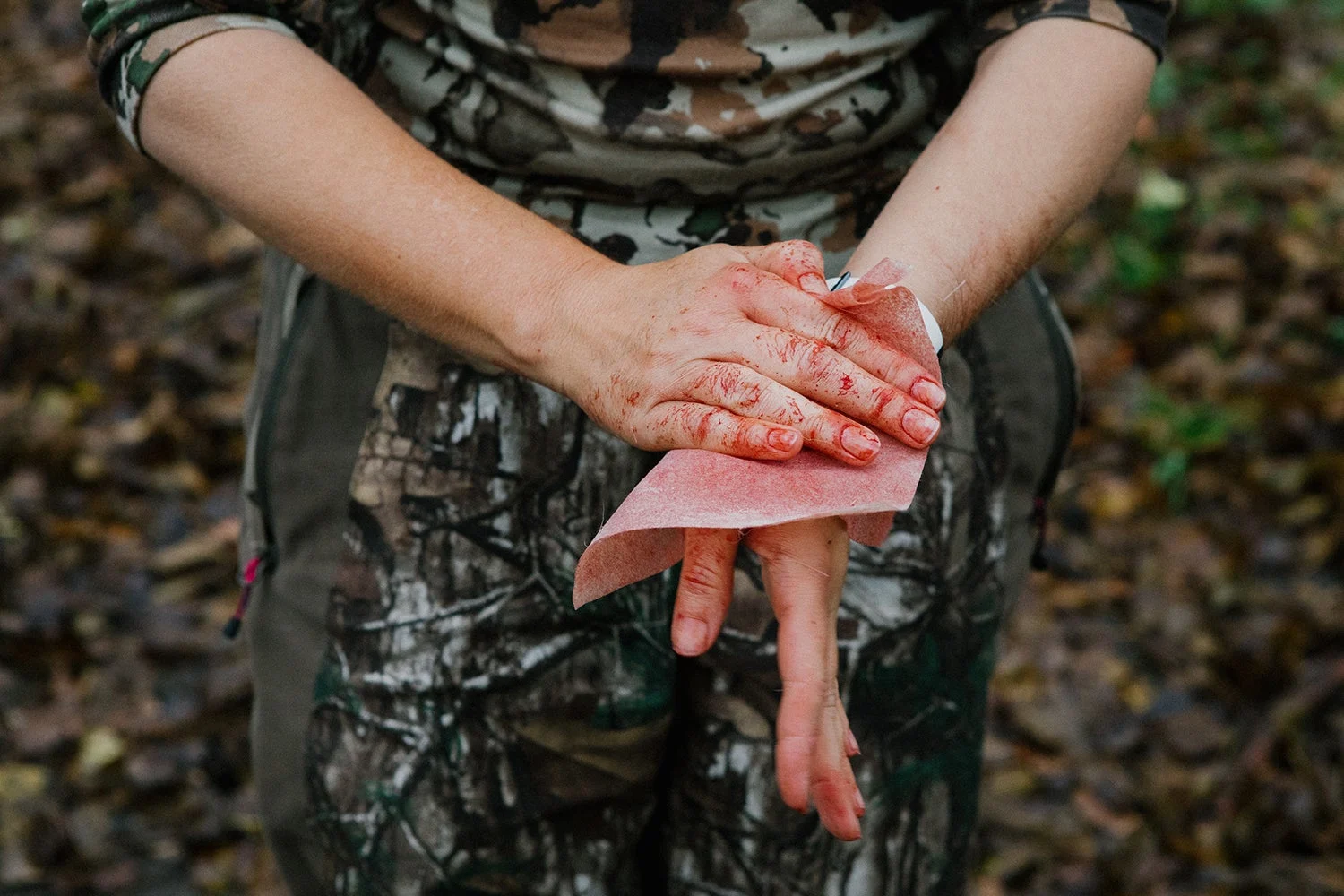 hunter cleans blood from hands