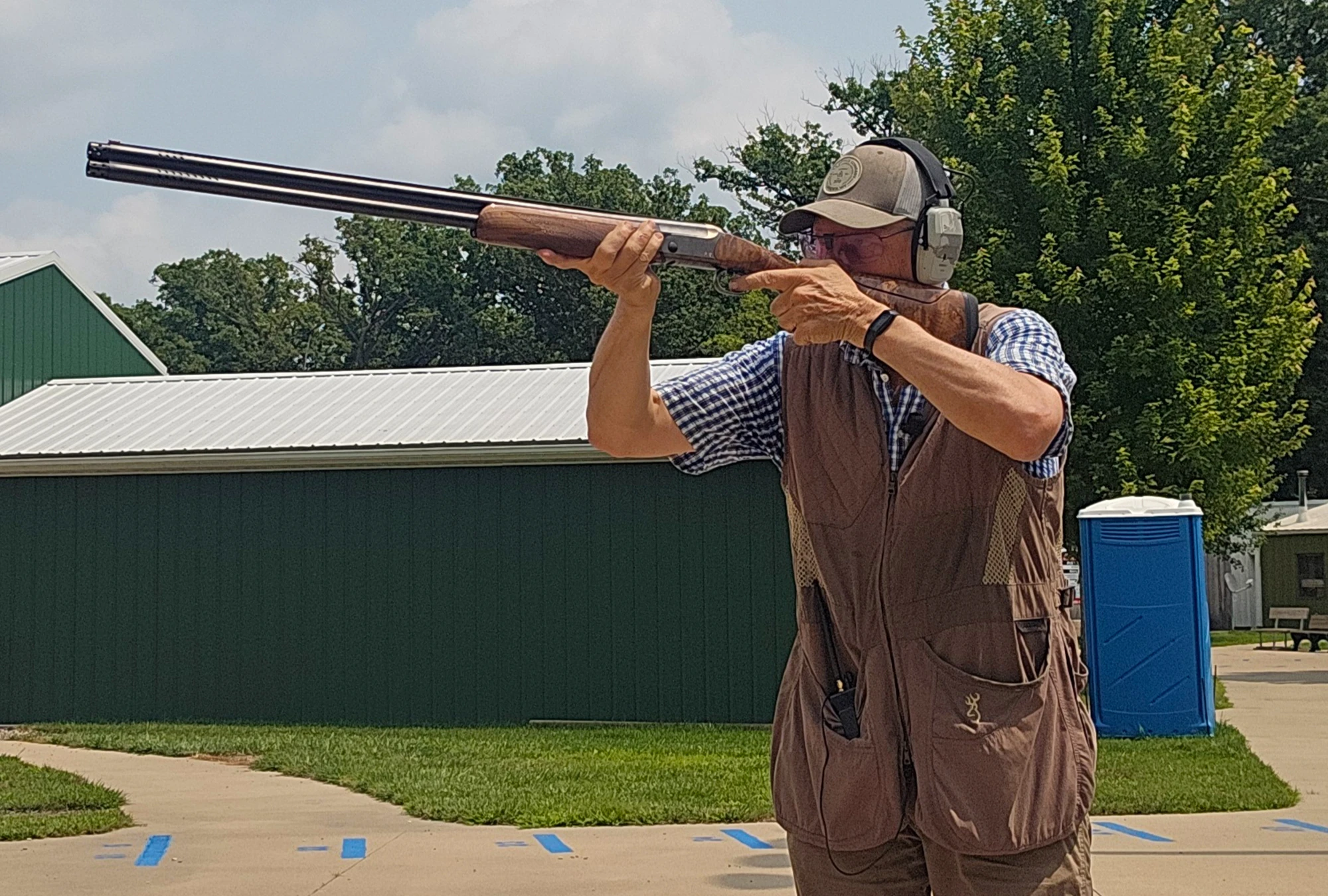 A shooter test fires the new Blaser F16 Pro Sporting shotgun on a skeet range. 