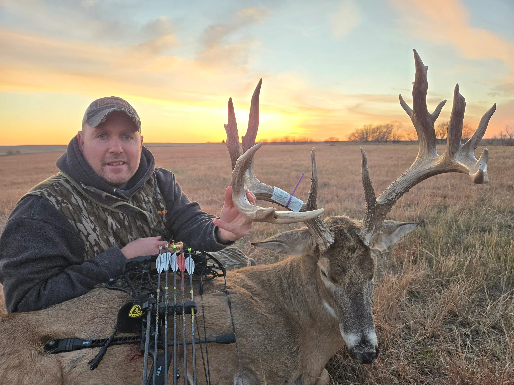 Hunter Eric Bothun poses with a trophy whitetail buck in Kansas. 