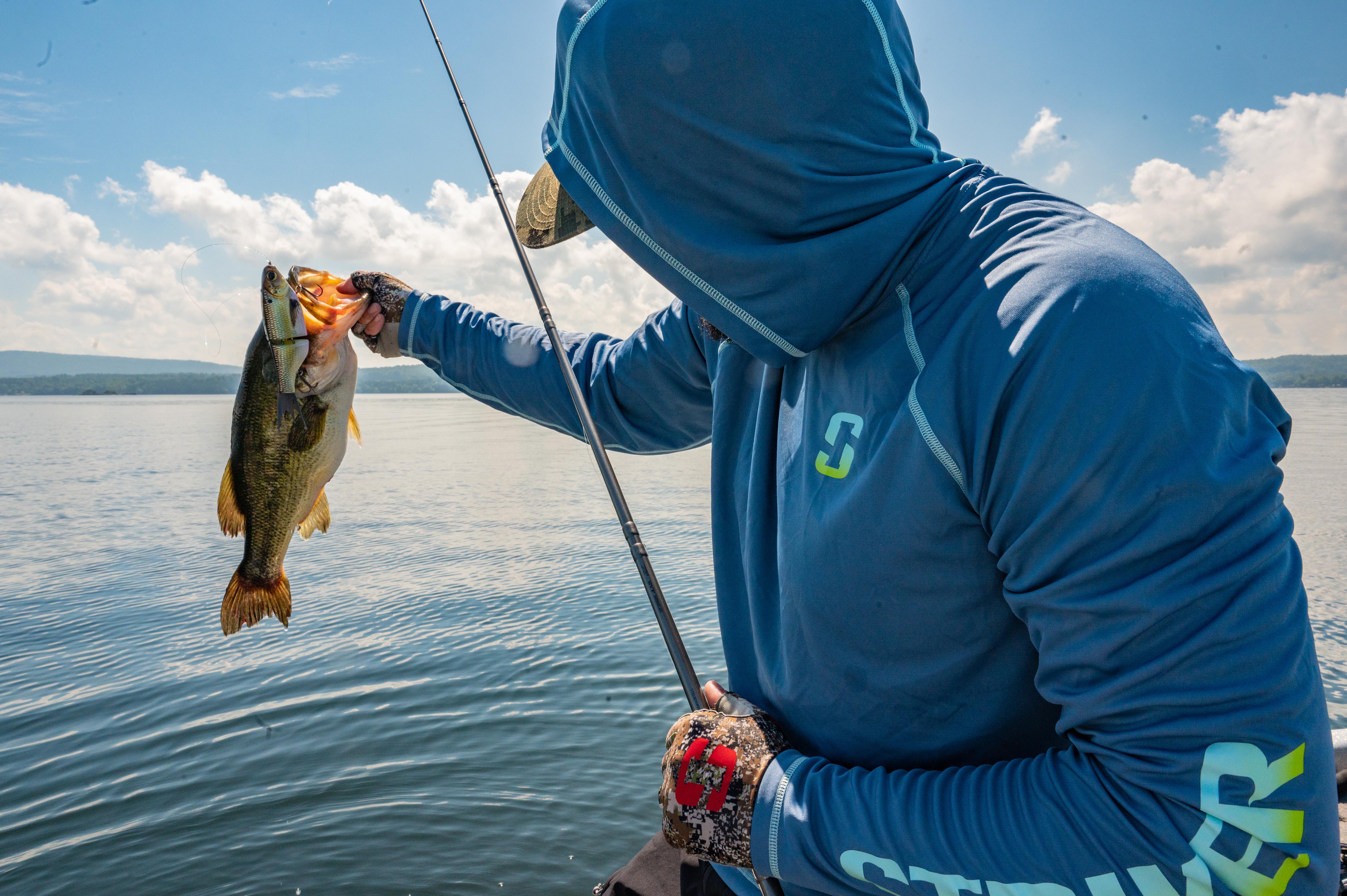 Angler holding up bass