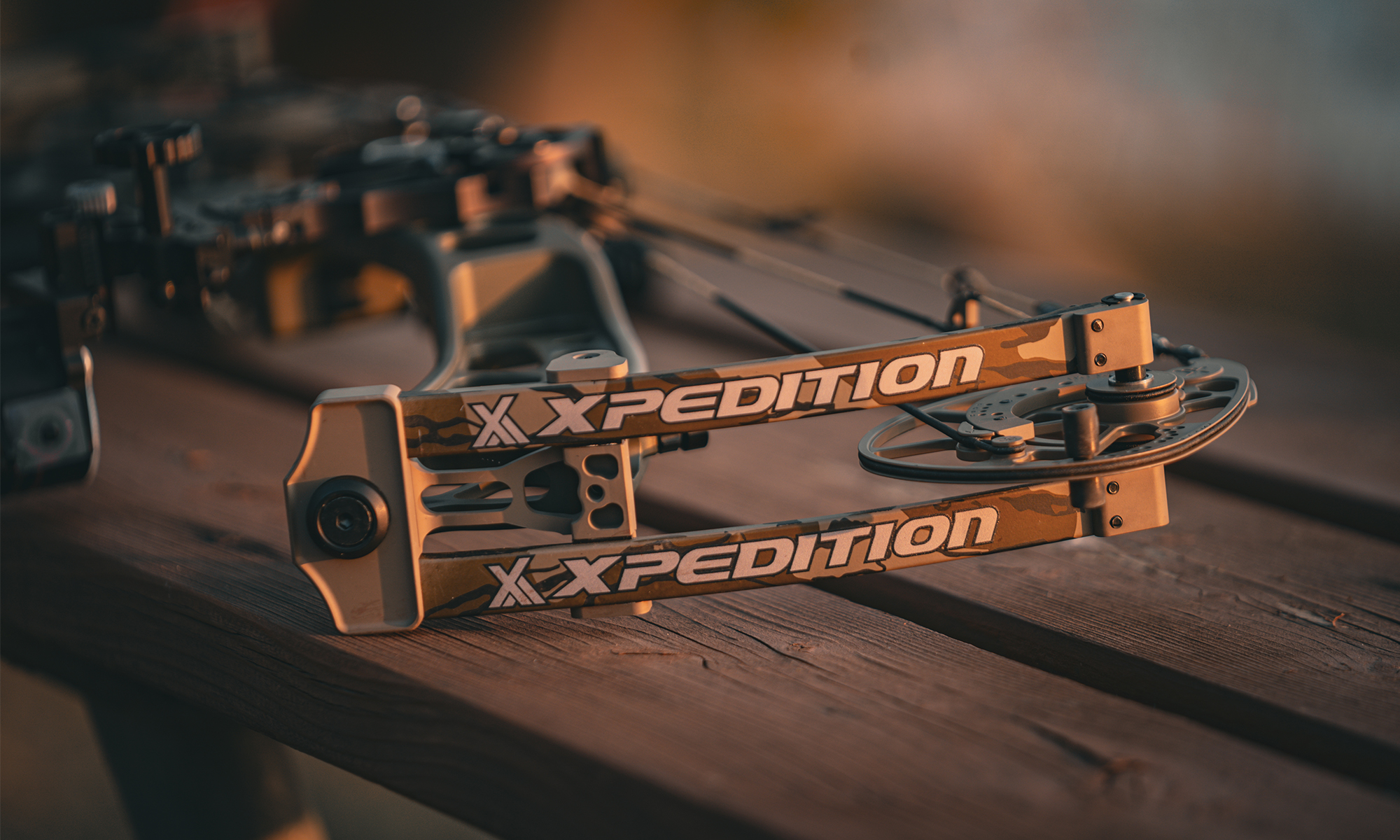 The new Xpedition Xlite 32 compound bow resting on an outdoor bench.  