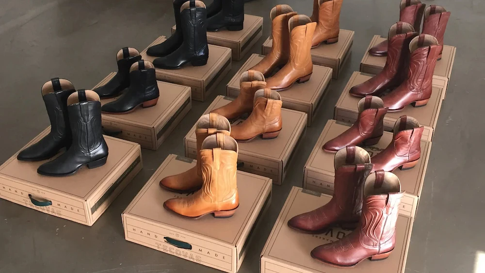 Tecovas cowboy boots lined up on boxes