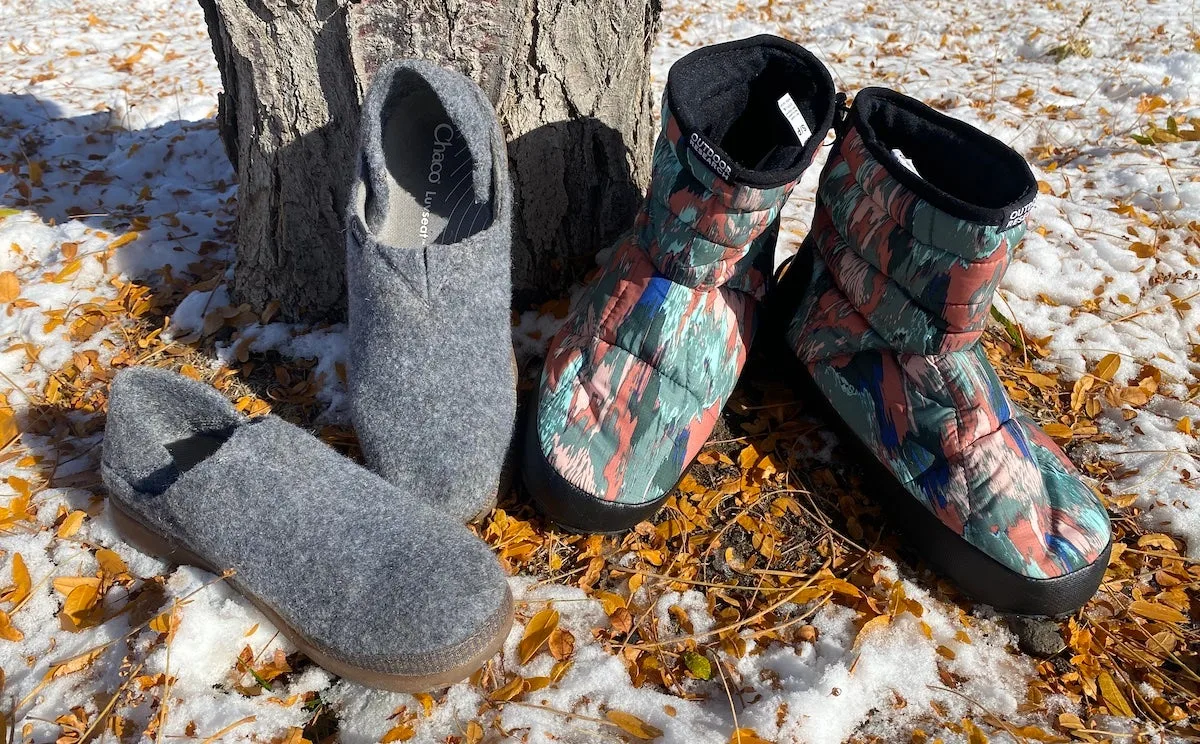 Chaco Revel and Outdoor Research Aerogel camping slippers on snowy ground