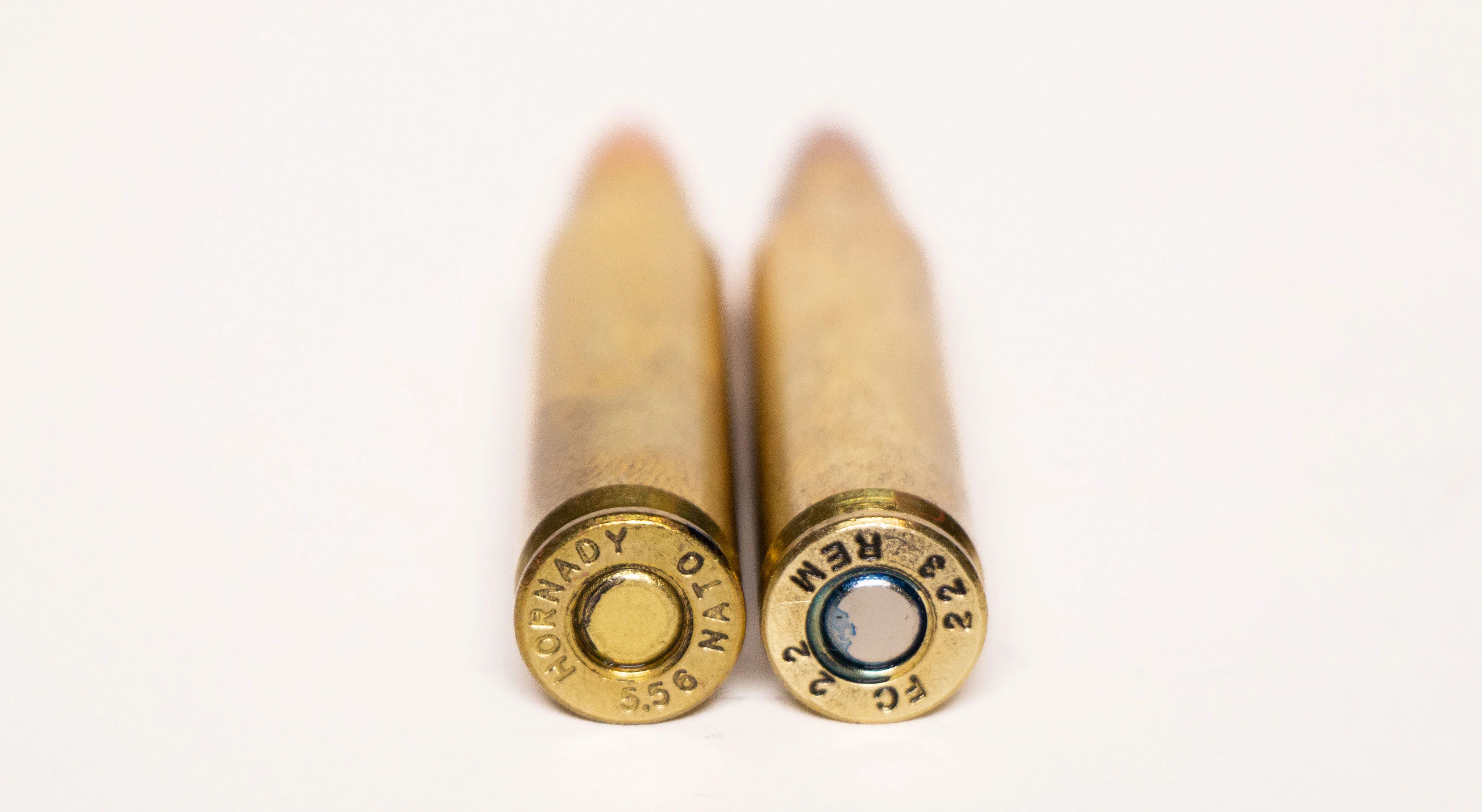 A 223 and a 556 cartridge side by side.