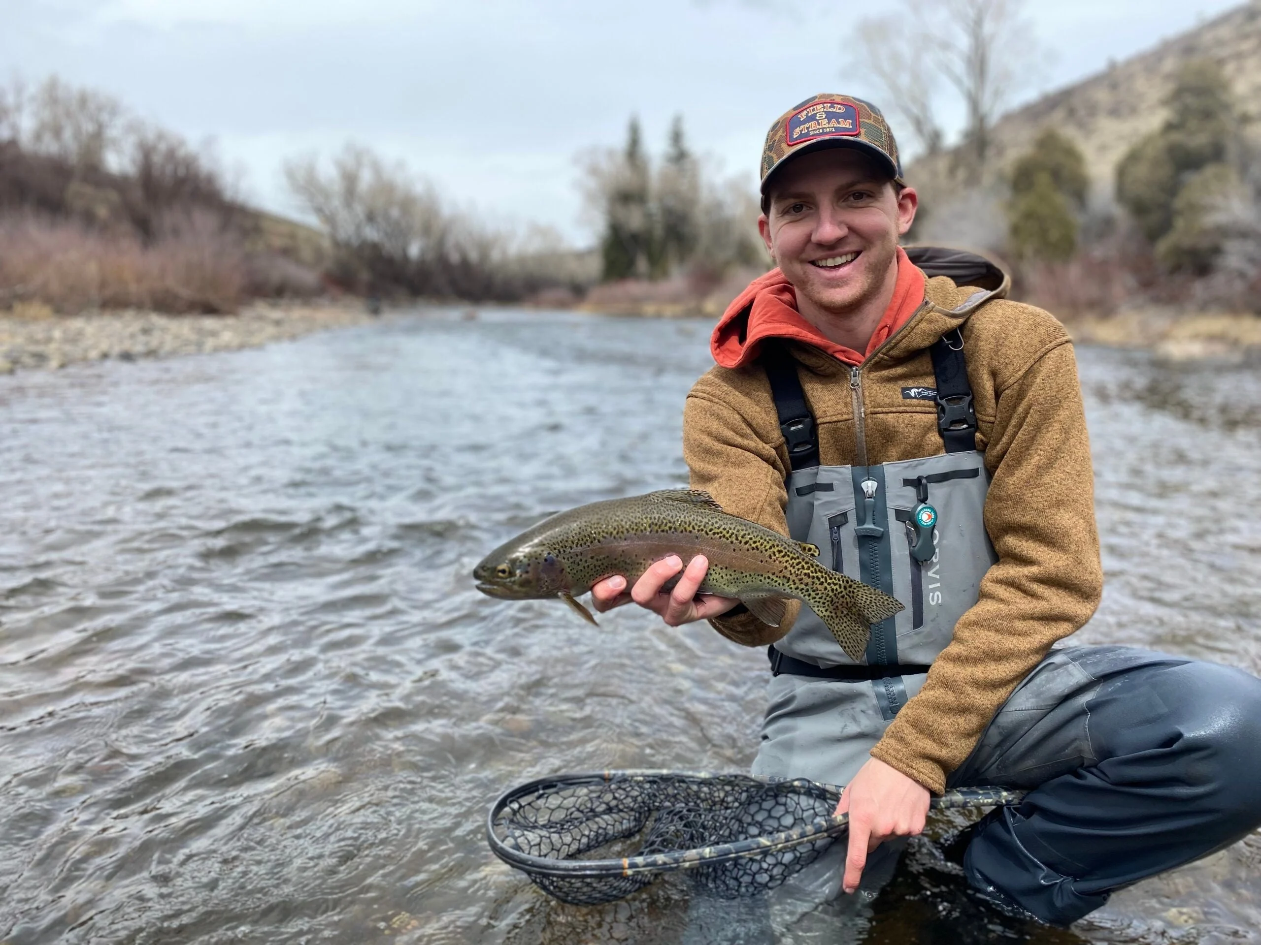 Angler in fly fishing waders