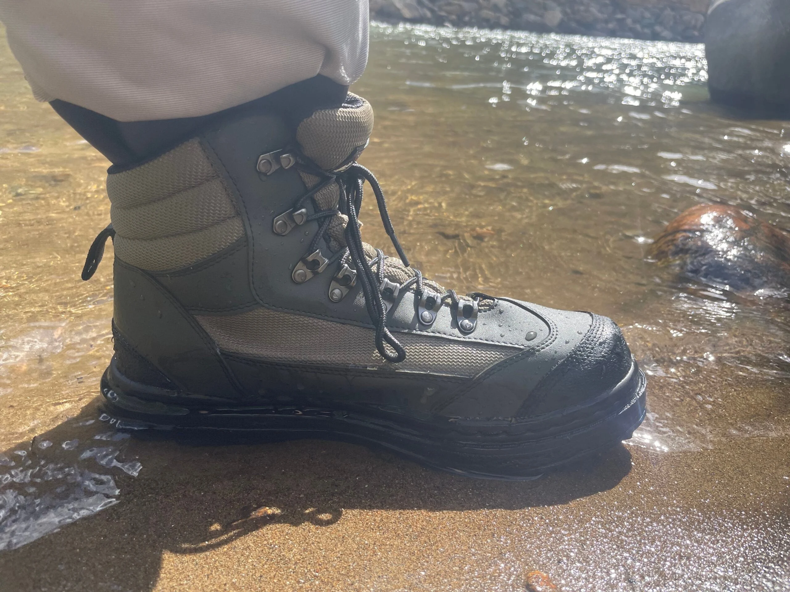 Close-up of angler wearing Frogg Toggs Hellbender wading boots during testing