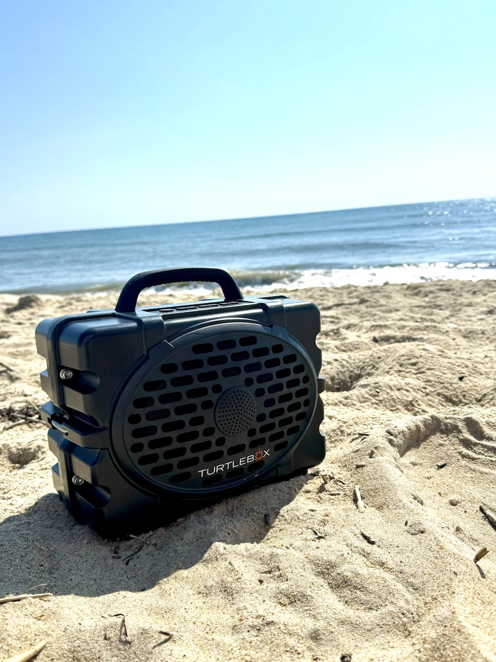 Turtlebox Gen 2 speaker sitting on the beach