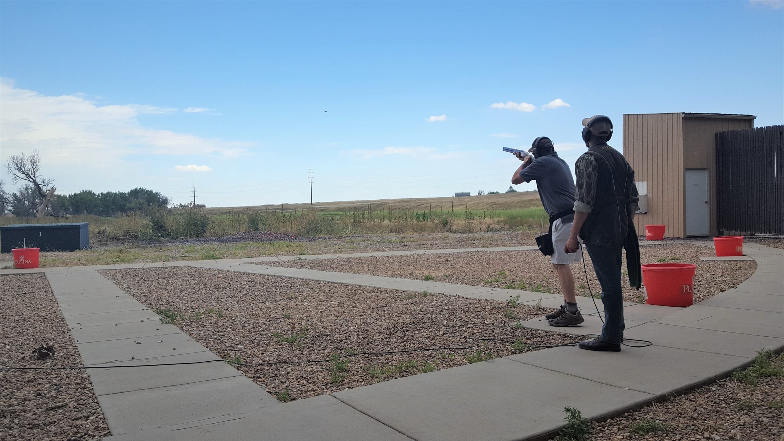 trap vs skeet: a shooter lines up to shoot skeet.