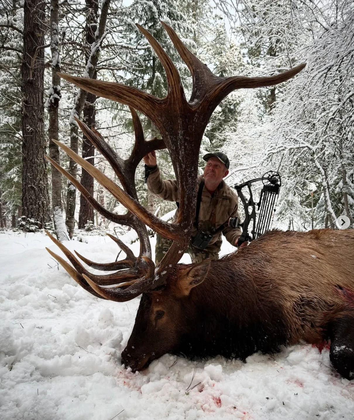 A noted elk hunter poses with a potential world-record bull. 