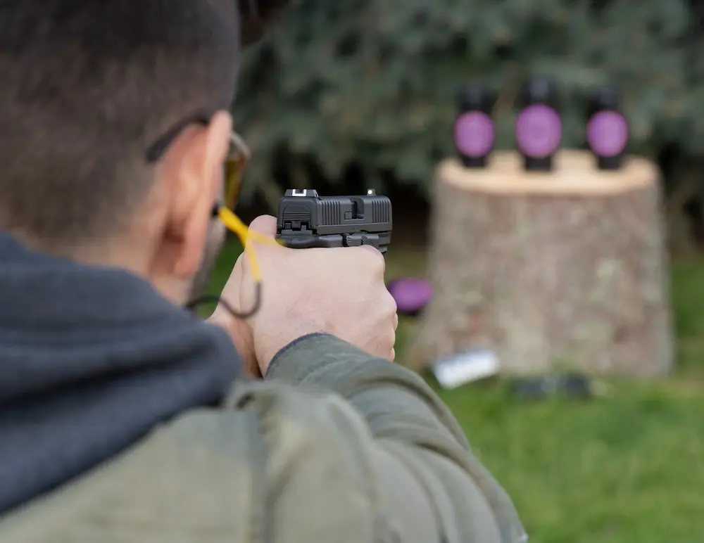 Man shooting Glock 44 22 LR Pistol