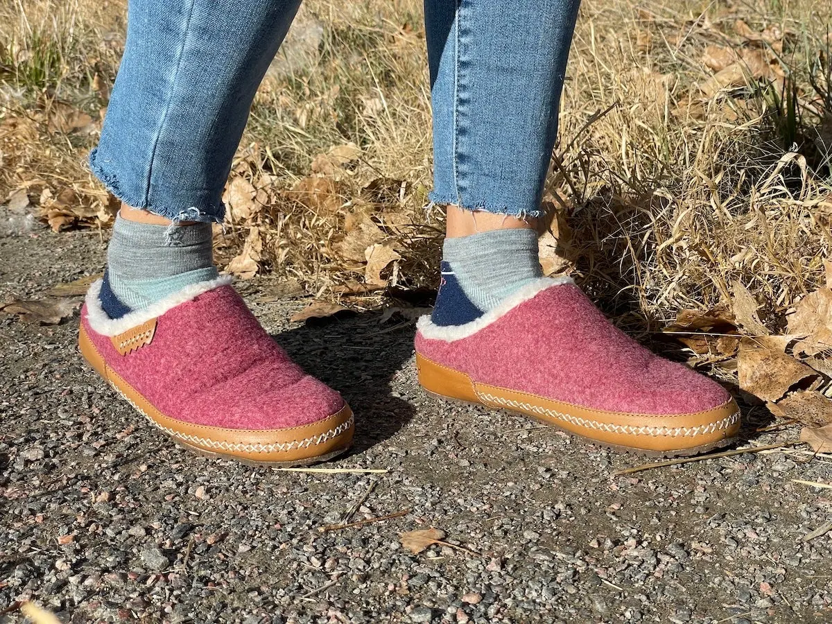 Woman wearing Manitobah Renew Clog Slippers outside