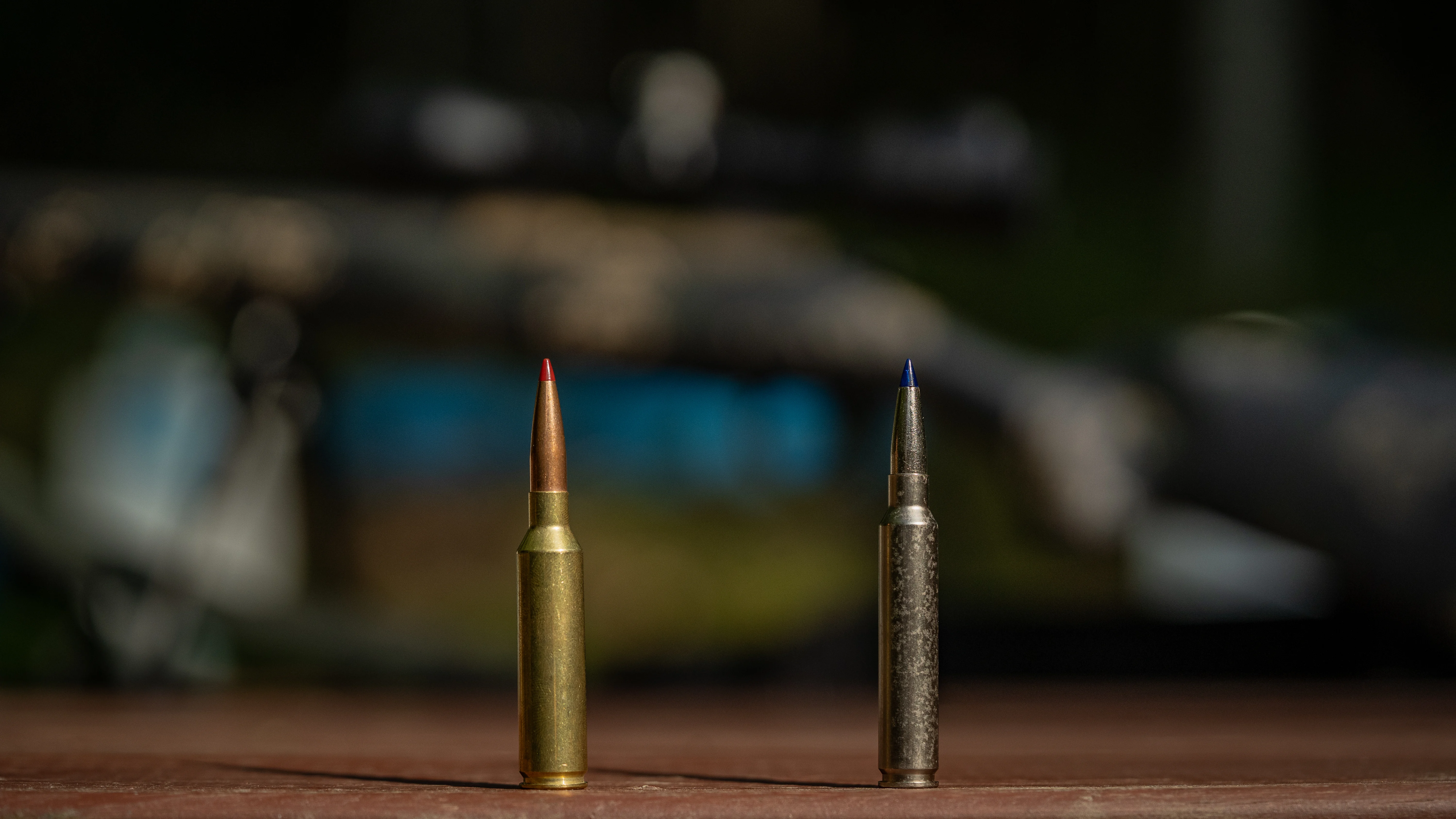 7mm PRC vs 7mm Backcountry cartridges, resting on a shooting bench.