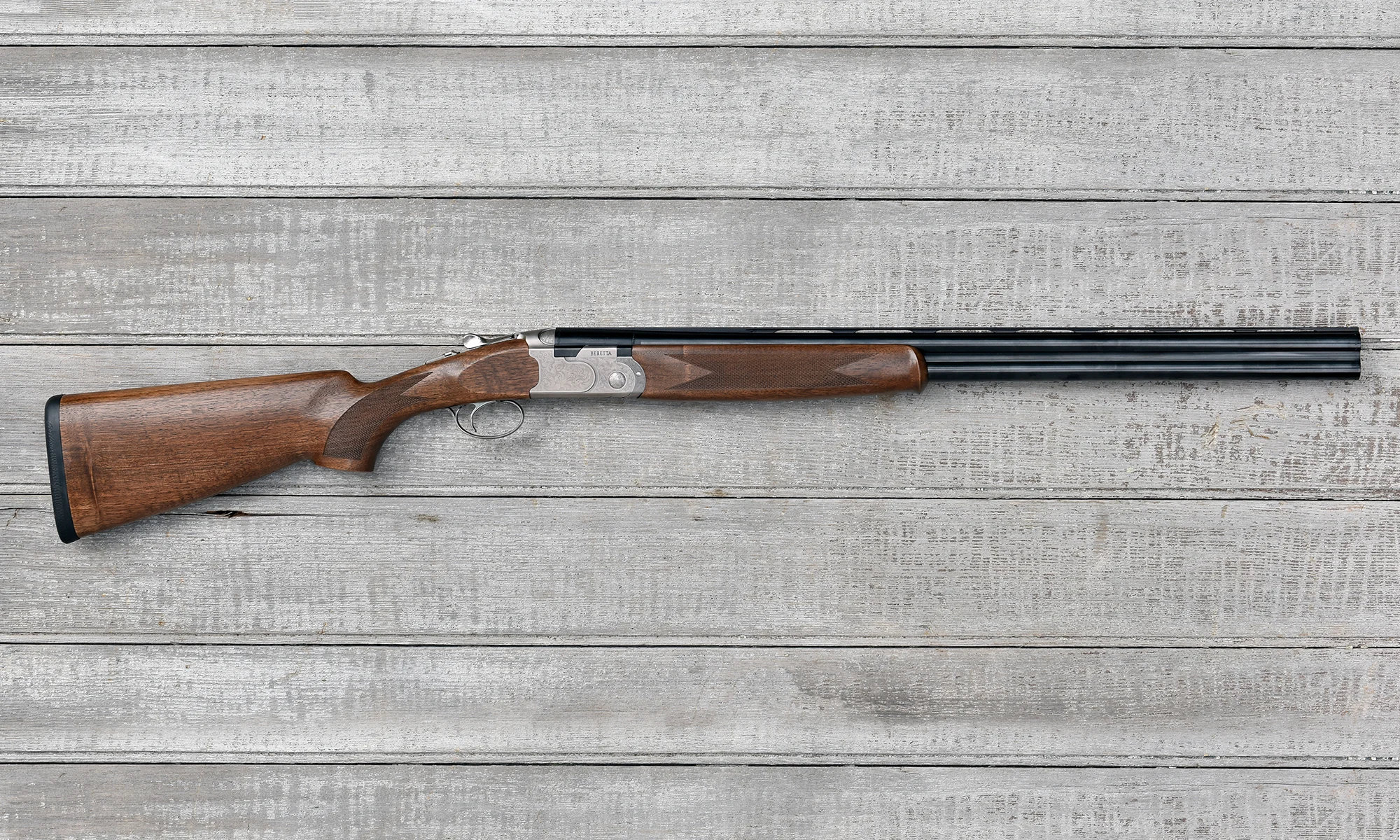 Beretta's new 686 Silver Pigeon I O/U shotgun on barn boards.