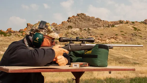 photo of hunter shooting rifle