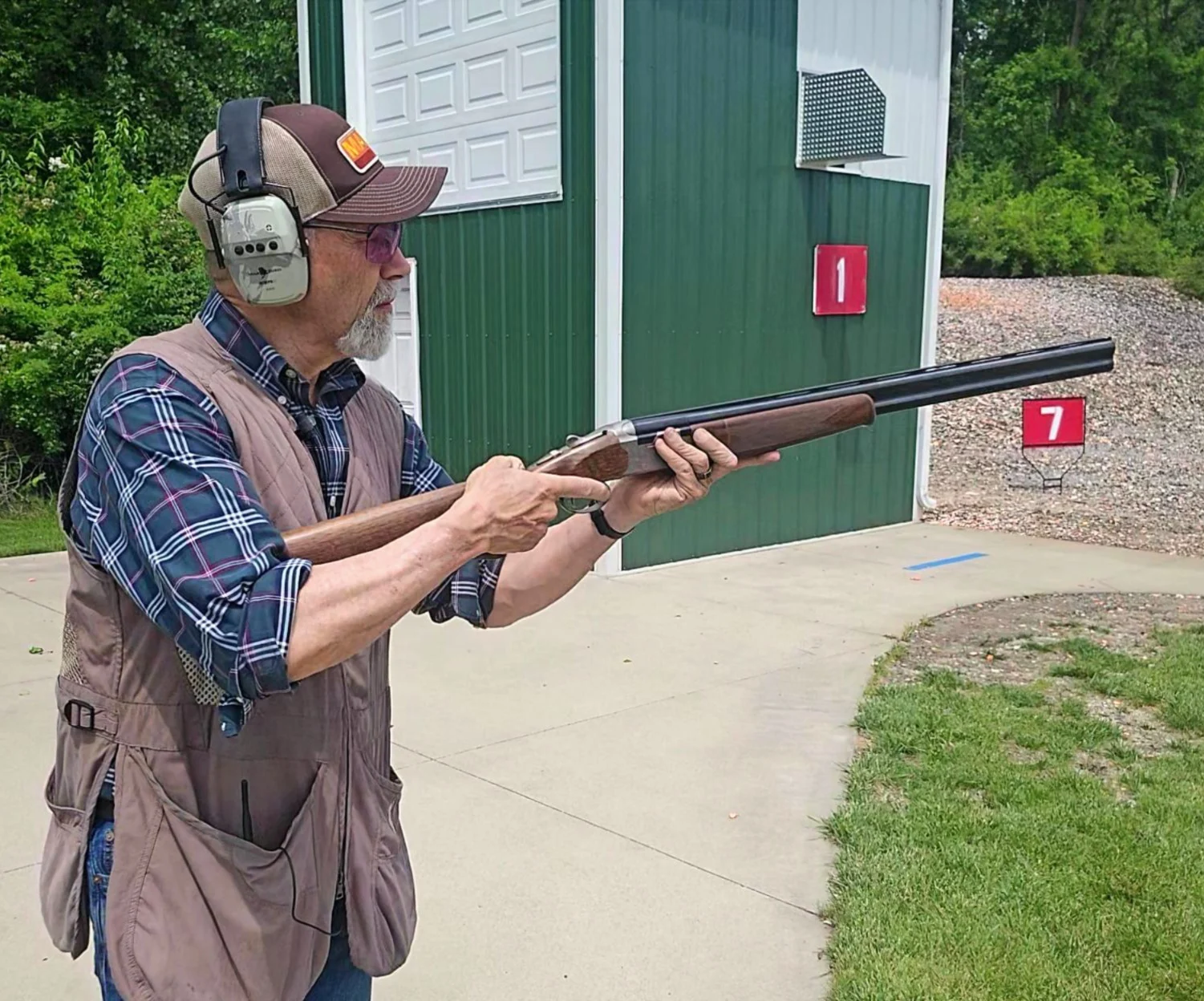 A shooter gets ready to fire the new Beretta 686 Silver Pigeon I shotgun on the skeet range. 
