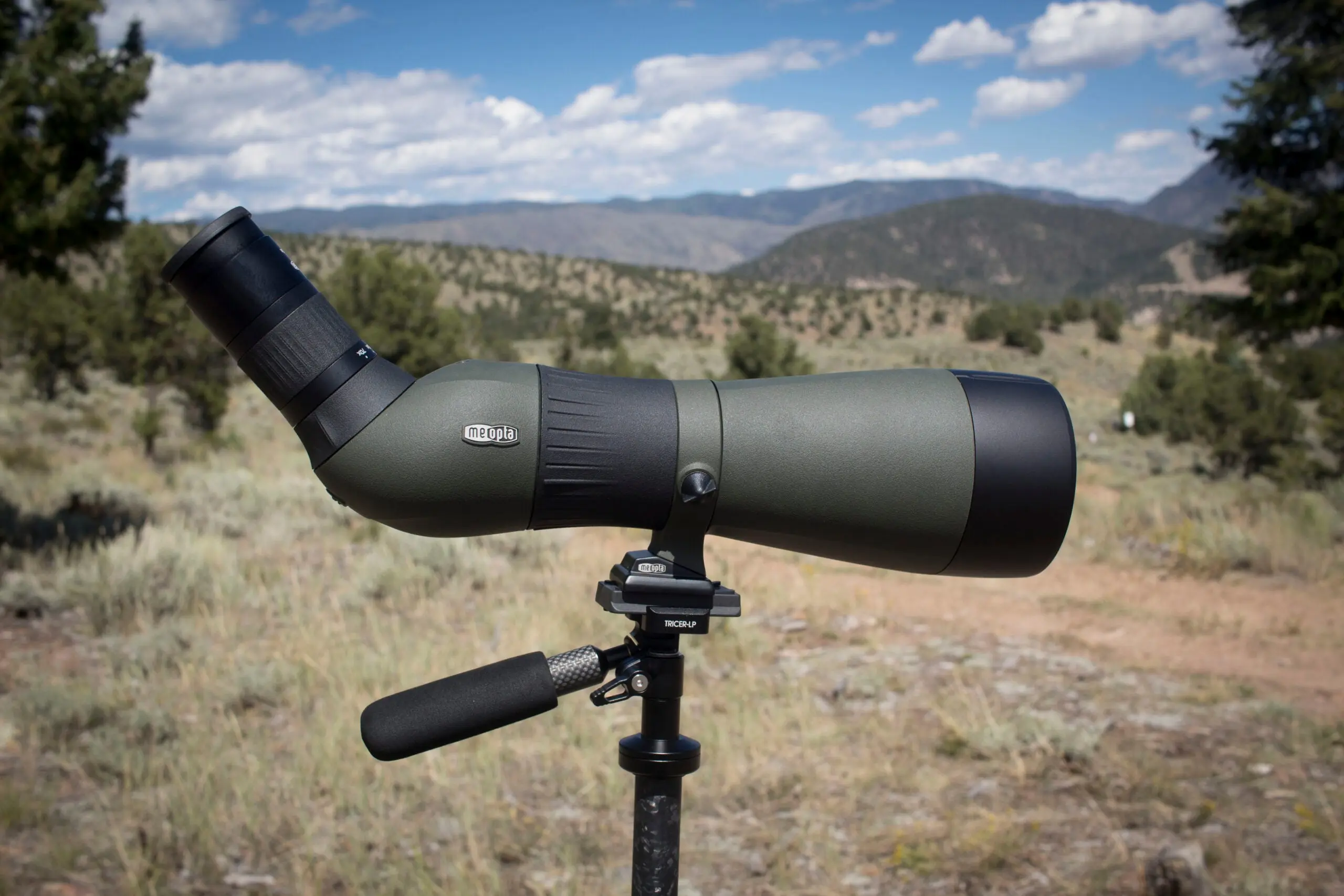 Meopta MeoStar spotting scope on tripod with mountains in background