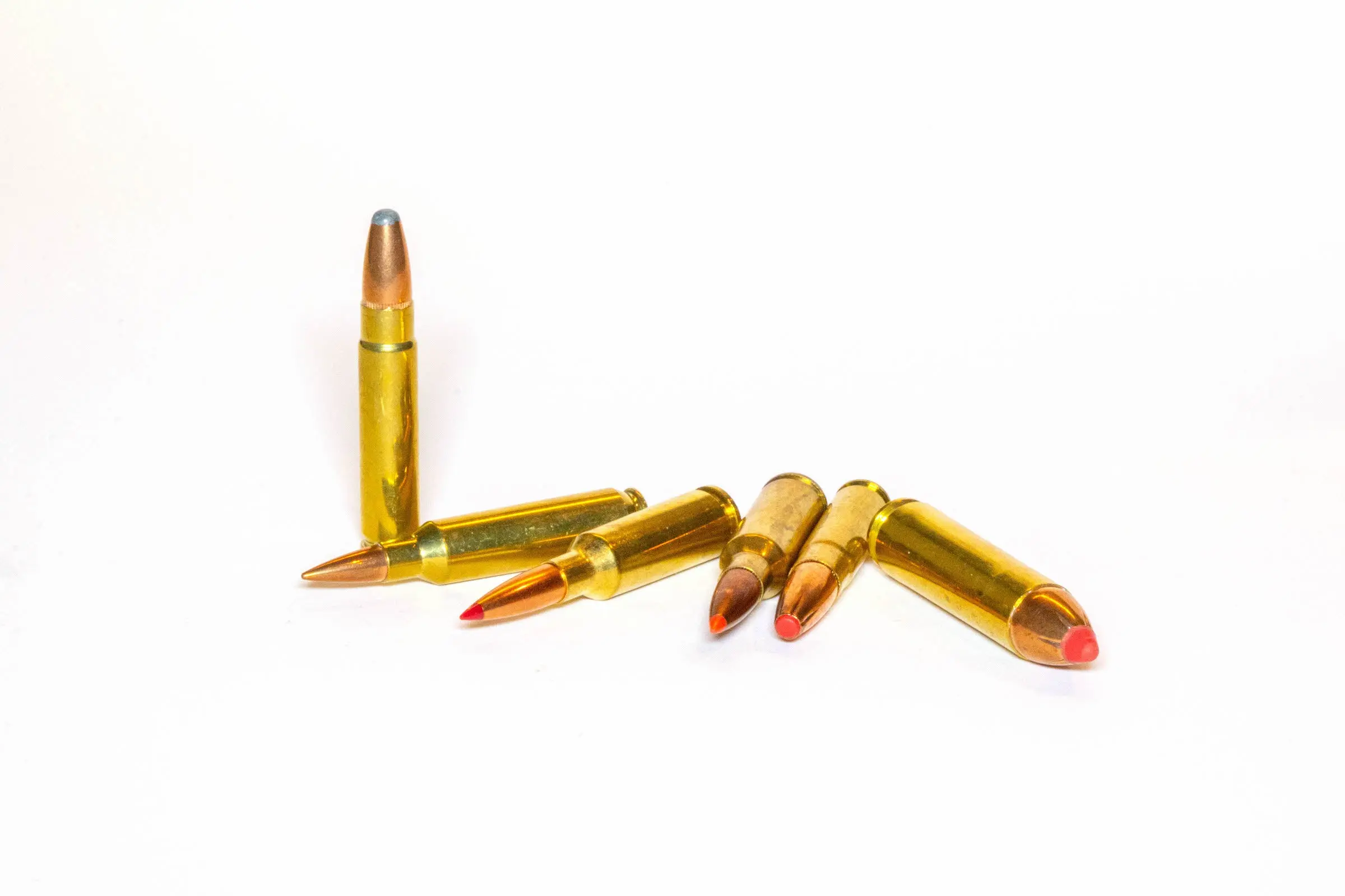 Rifle cartridges on a white background.