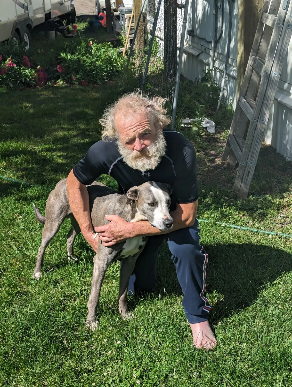 Brandon Garrett with his dog Blue.