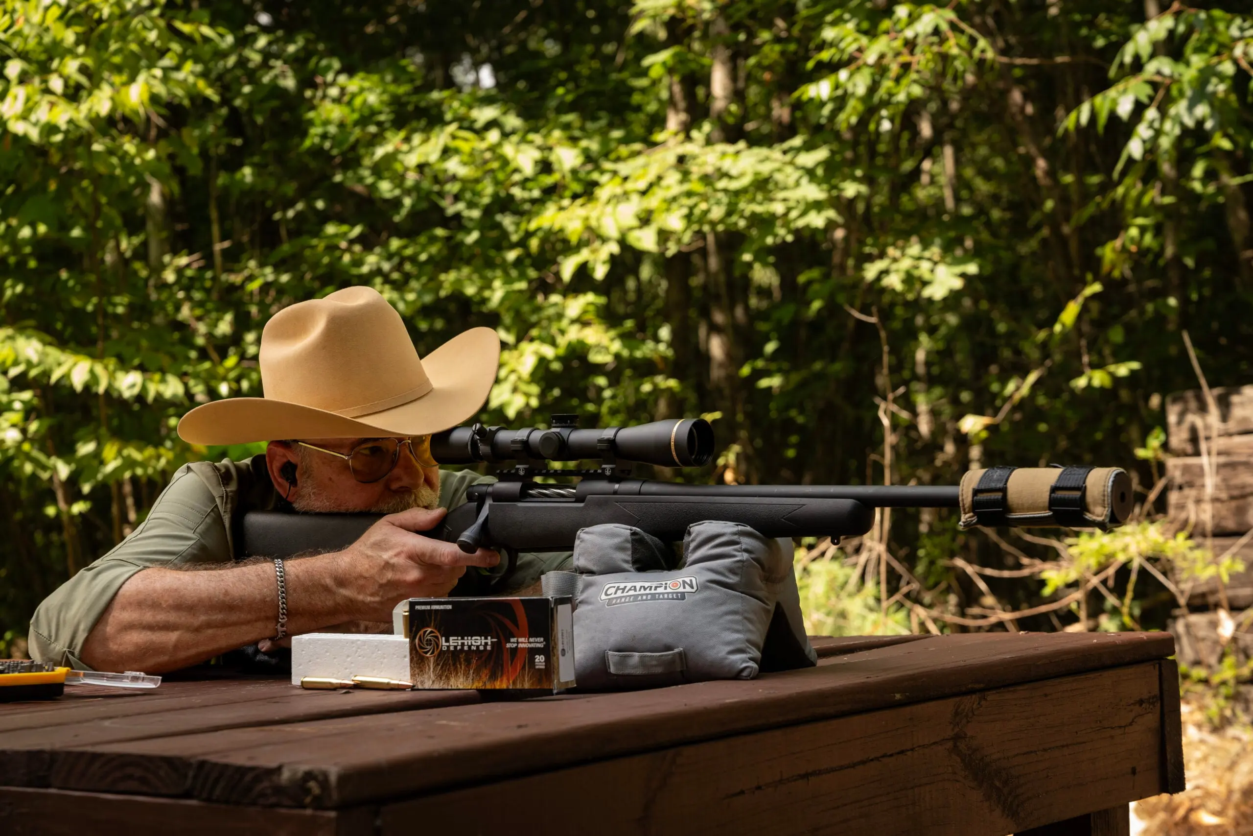 A shooter test fires the Mossberg Patriot Predator SF rifle from a bench rest