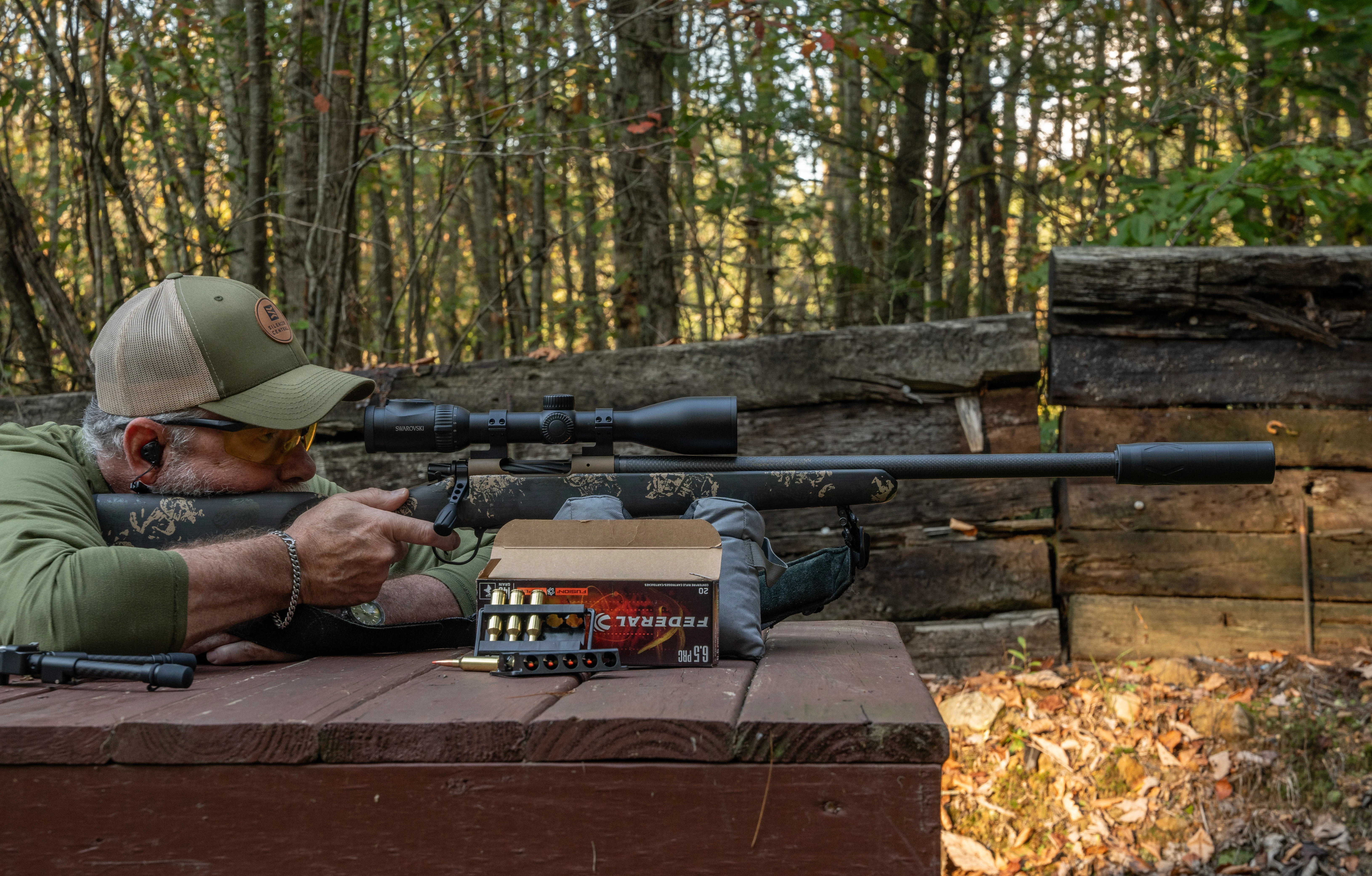 A shooter fires the Christensen Ridgeline FFT bolt-action rifle from a bench rest. 