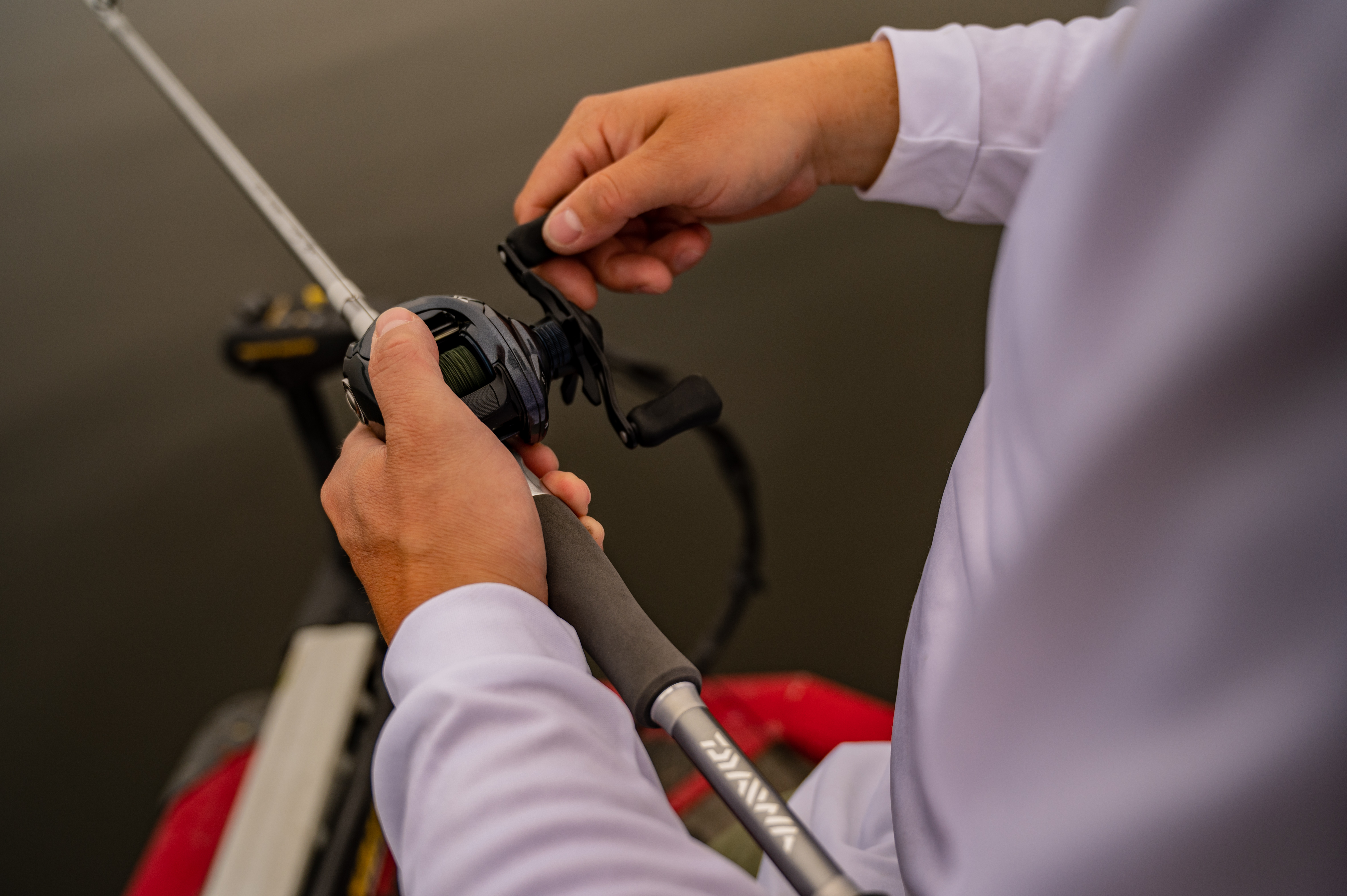 Angler holding rod and reel