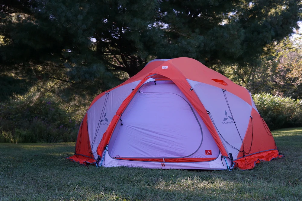 Slingfin OneUp Mountaineering Tent set up on grass with rainfly