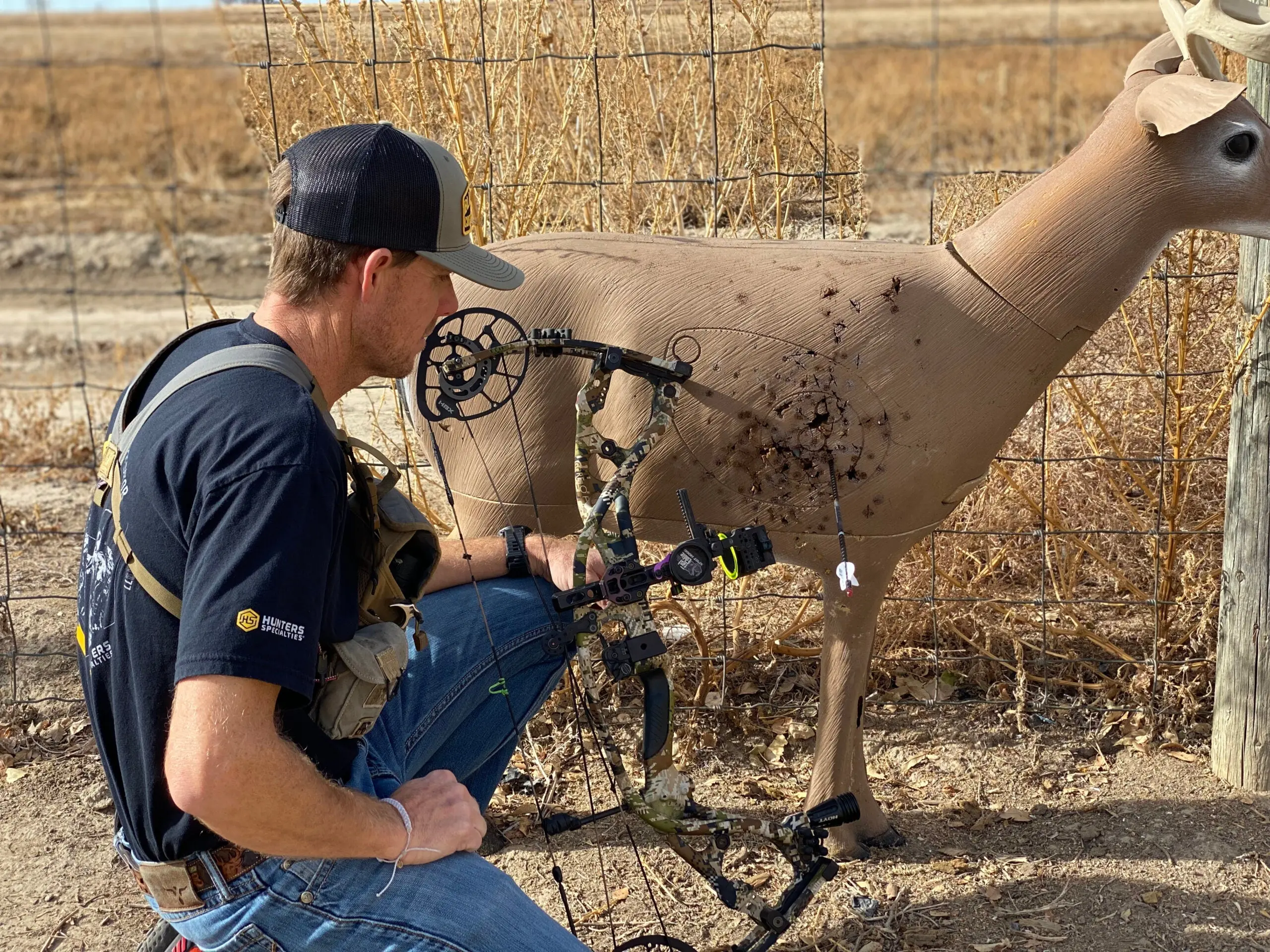 Archer taking arrows out of a target