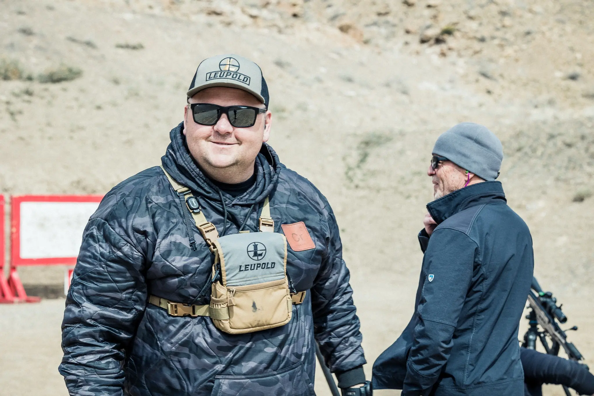 Instructor Chris Roberts standing on a shooting range.