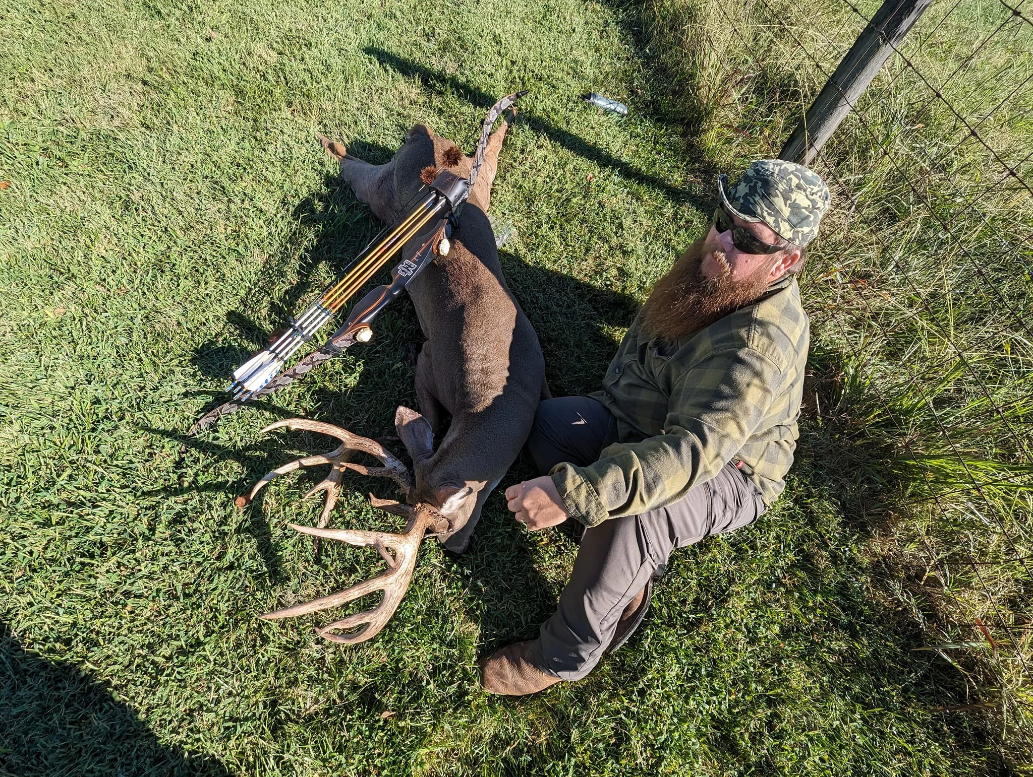 Kentucky hunter Bradley Poynter shows off a big whitetail buck he took with a recurve bow. 