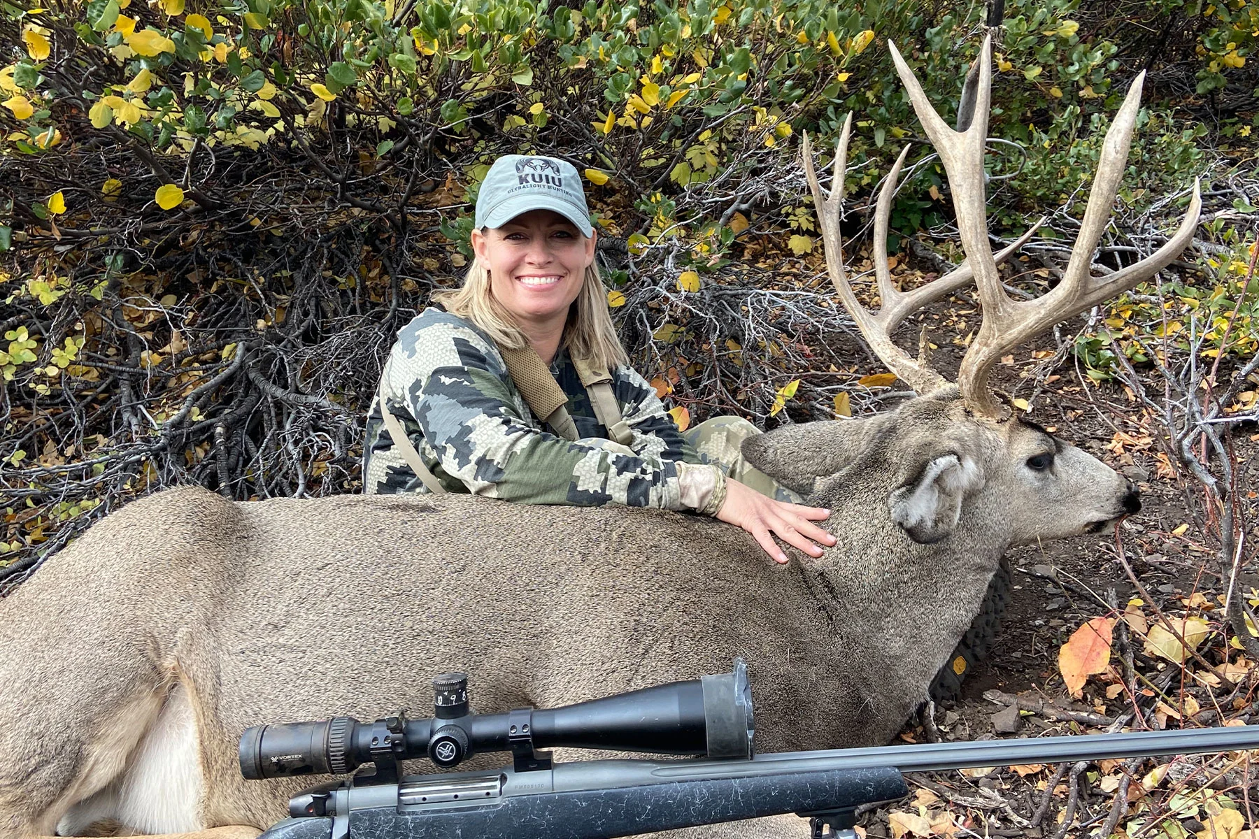 A hunter poses with Idaho muler deer taken with a rifle. 