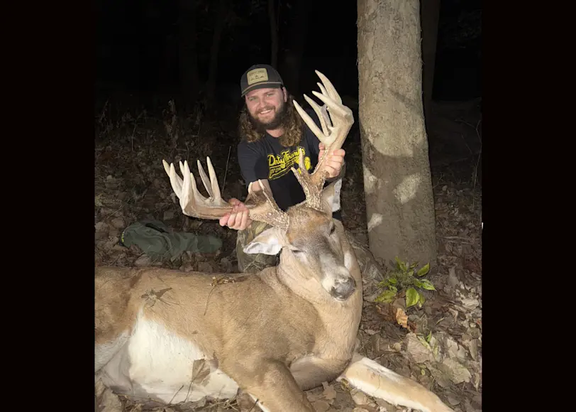 A hunter poses with a massive Ohio deer taken during the rut. 