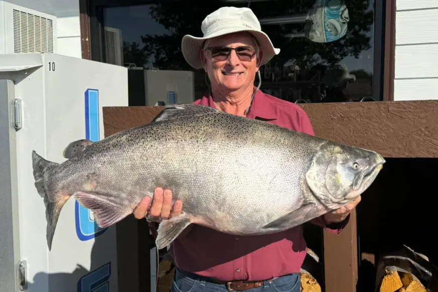 A Montana angler poses with a state-record Chinook salmon. 