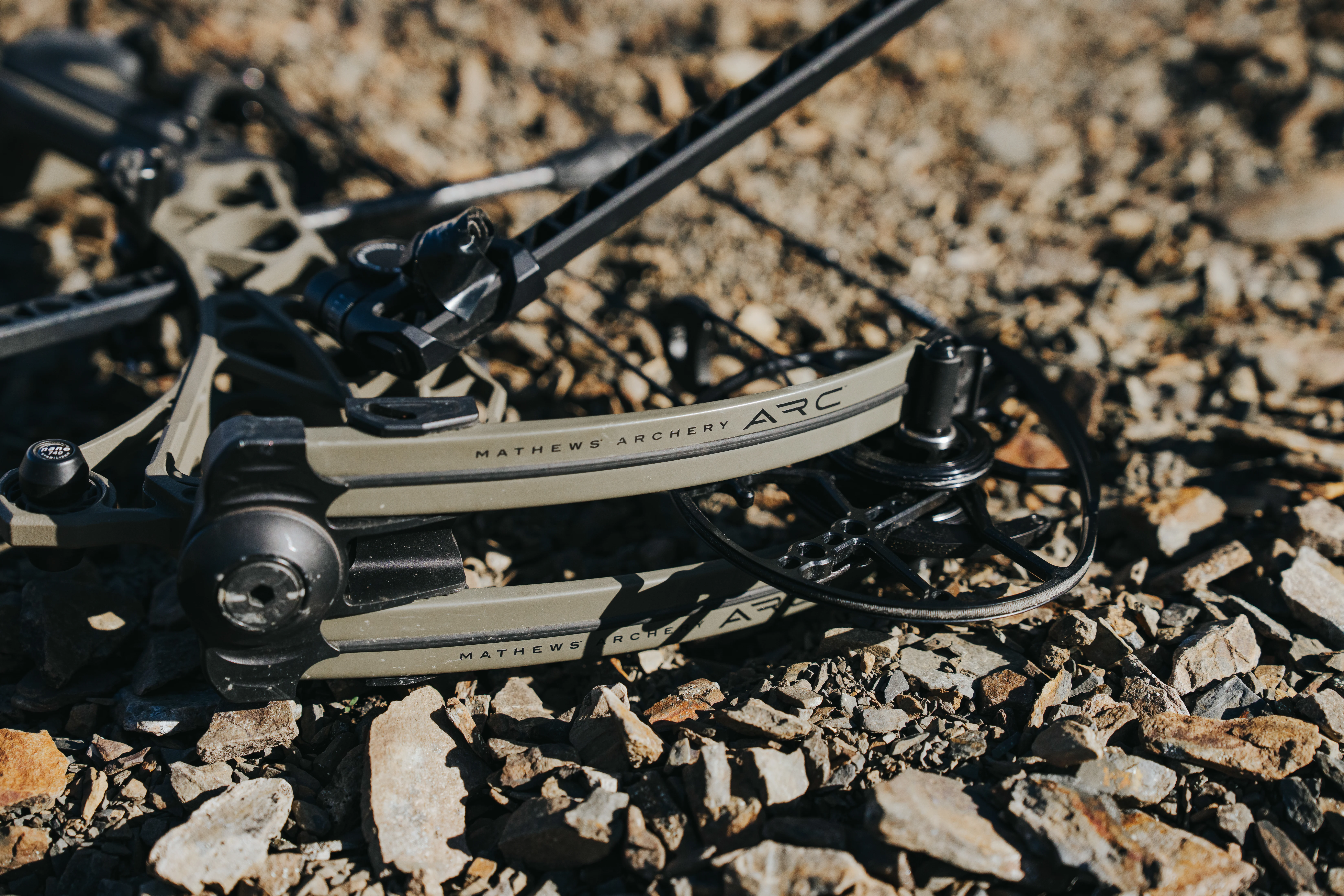 Mathews ARC 30 compound bow lying on the the ground. 
