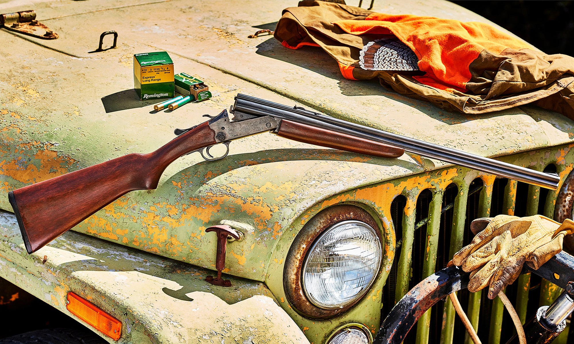 A Savage Model 24 resting on an old Jeep. 