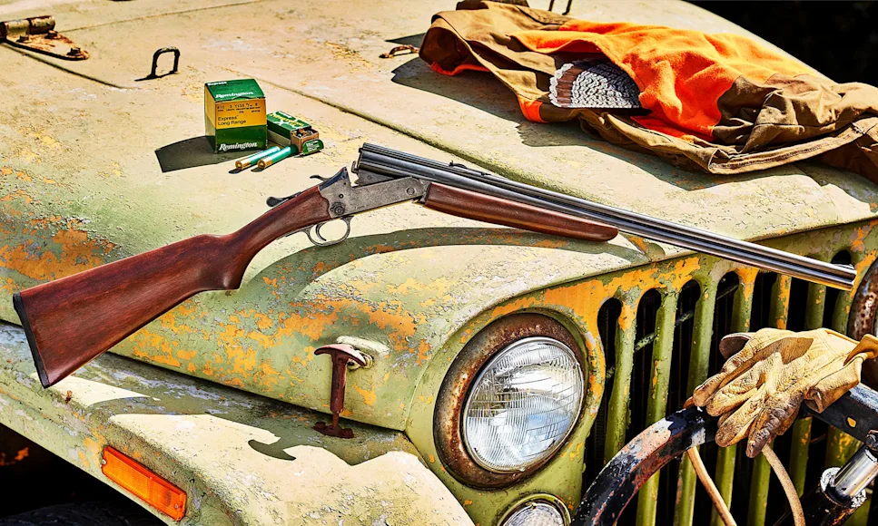 A Savage Model 24 resting on an old Jeep.
