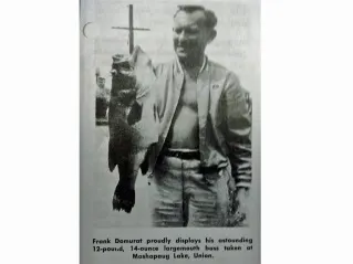 An angler poses with the Connecticut state record for largemouth bass. 