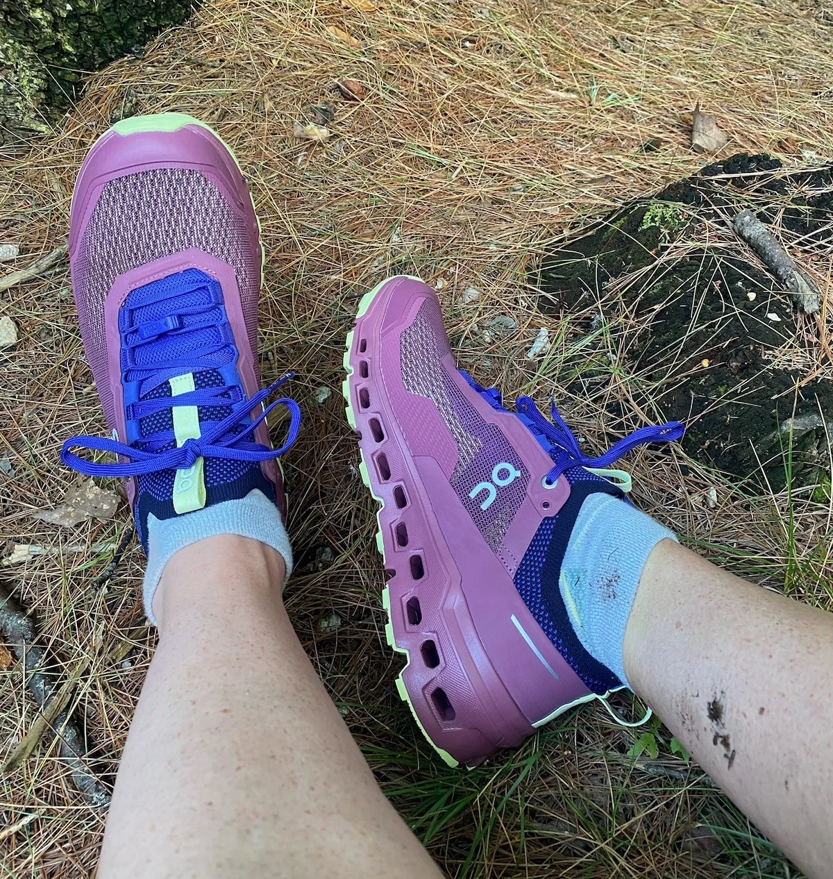 Woman wearing On Cloudultra 2 running shoes on the trail