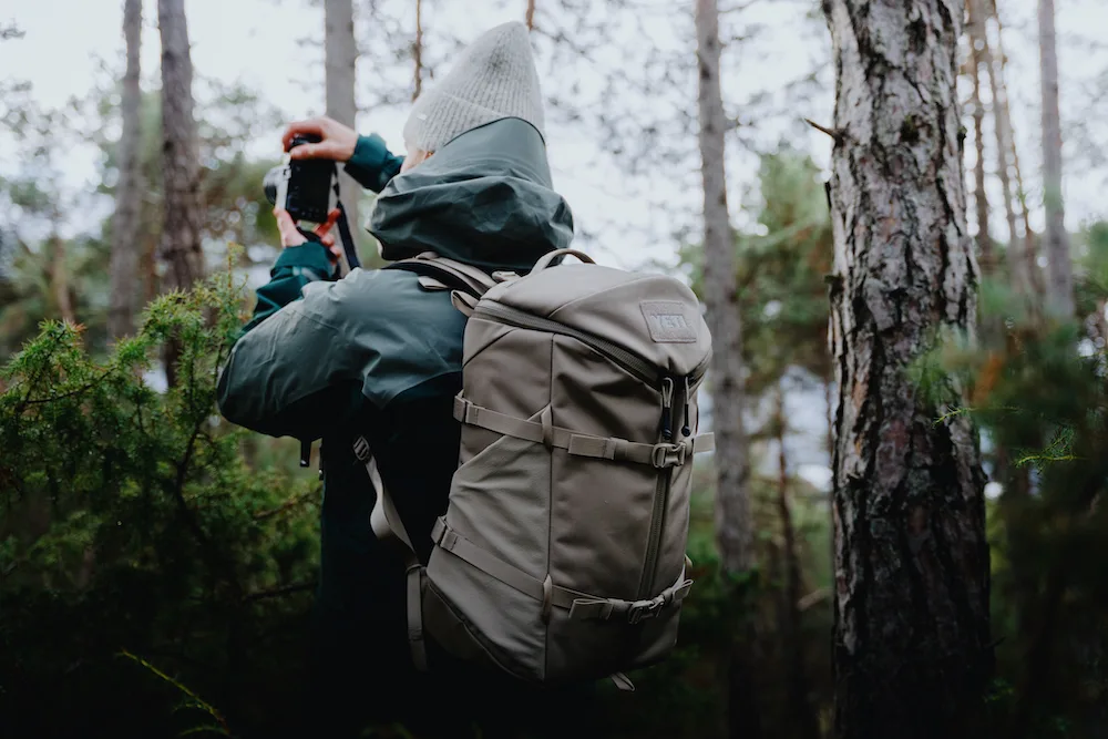 Birdwatcher wearing Yeti Ranchero Backpack