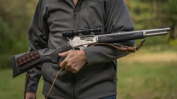 Man holding an 1895 Marlin.