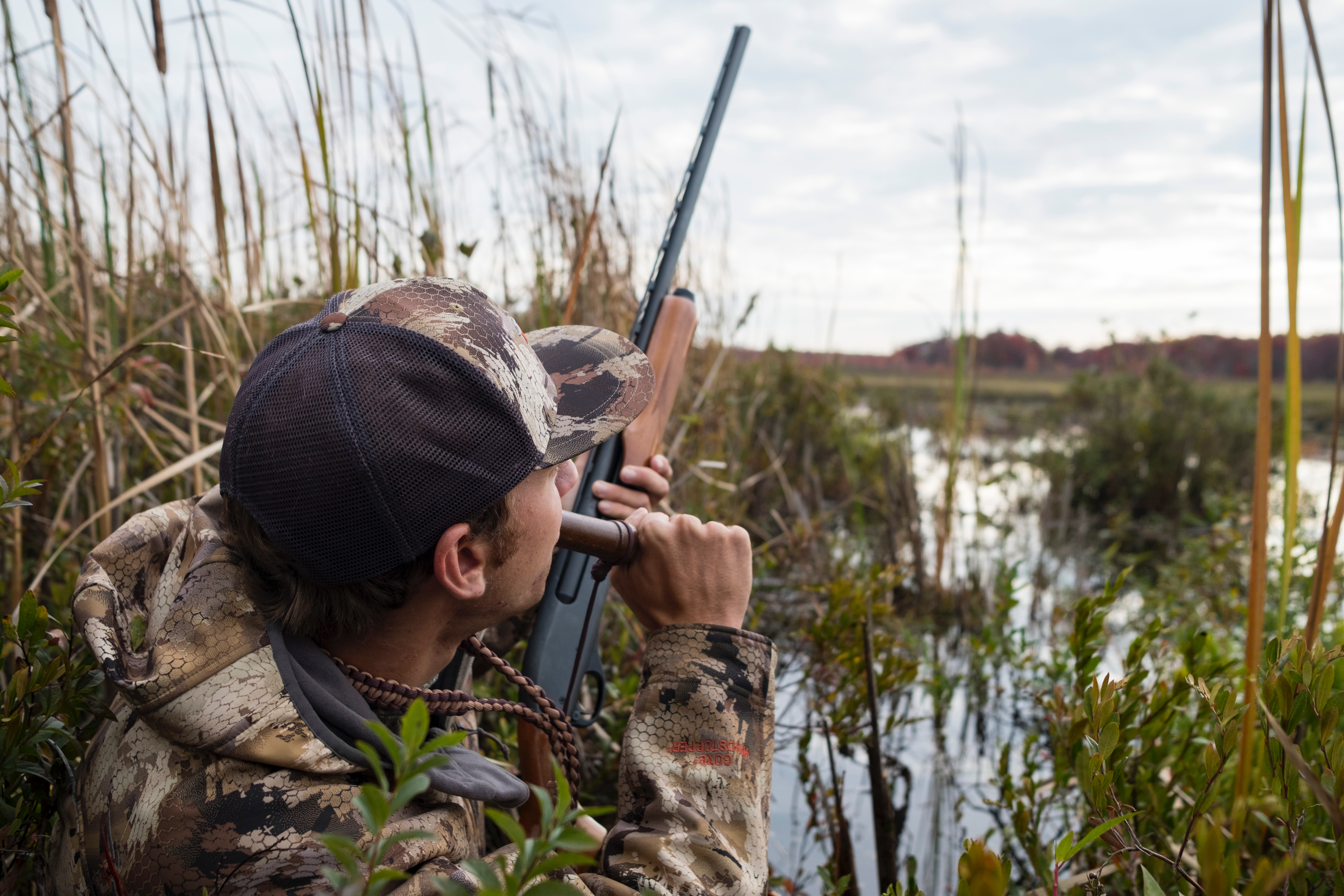 Duck hunter blowing a duck call