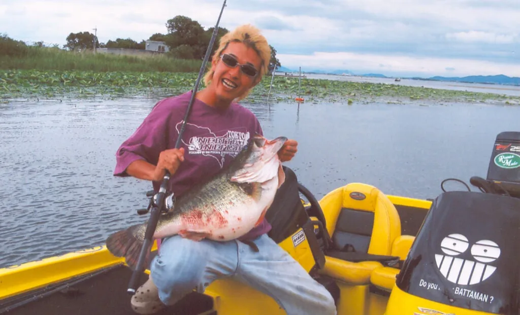 man holding largemouth bass. 