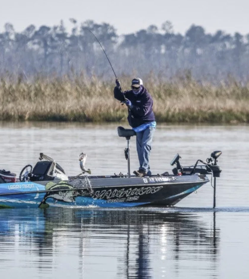 Pro bass angler Larry Nixon catches a spring largemouth. 