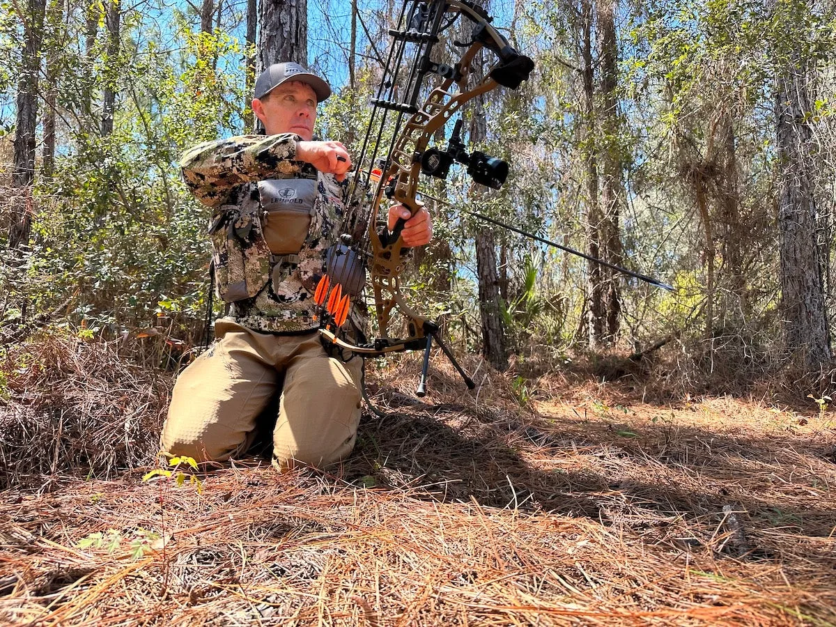 Turkey hunter wearing Sitka Equinox turkey vest in the woods