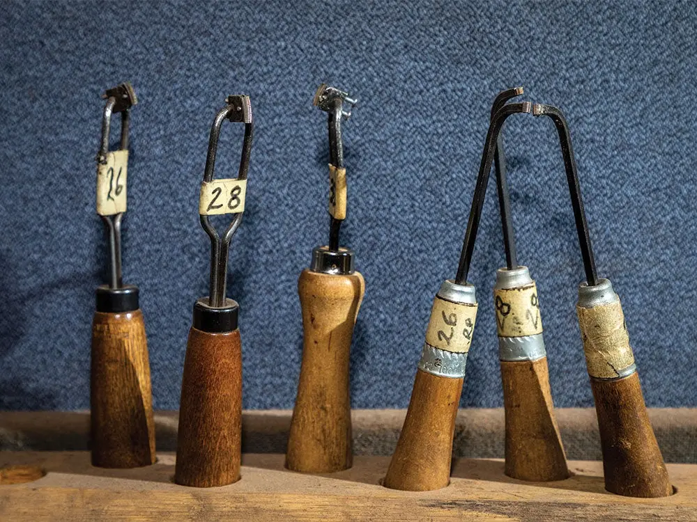 several tools that are used to apply checkered patterns to wood gun stocks