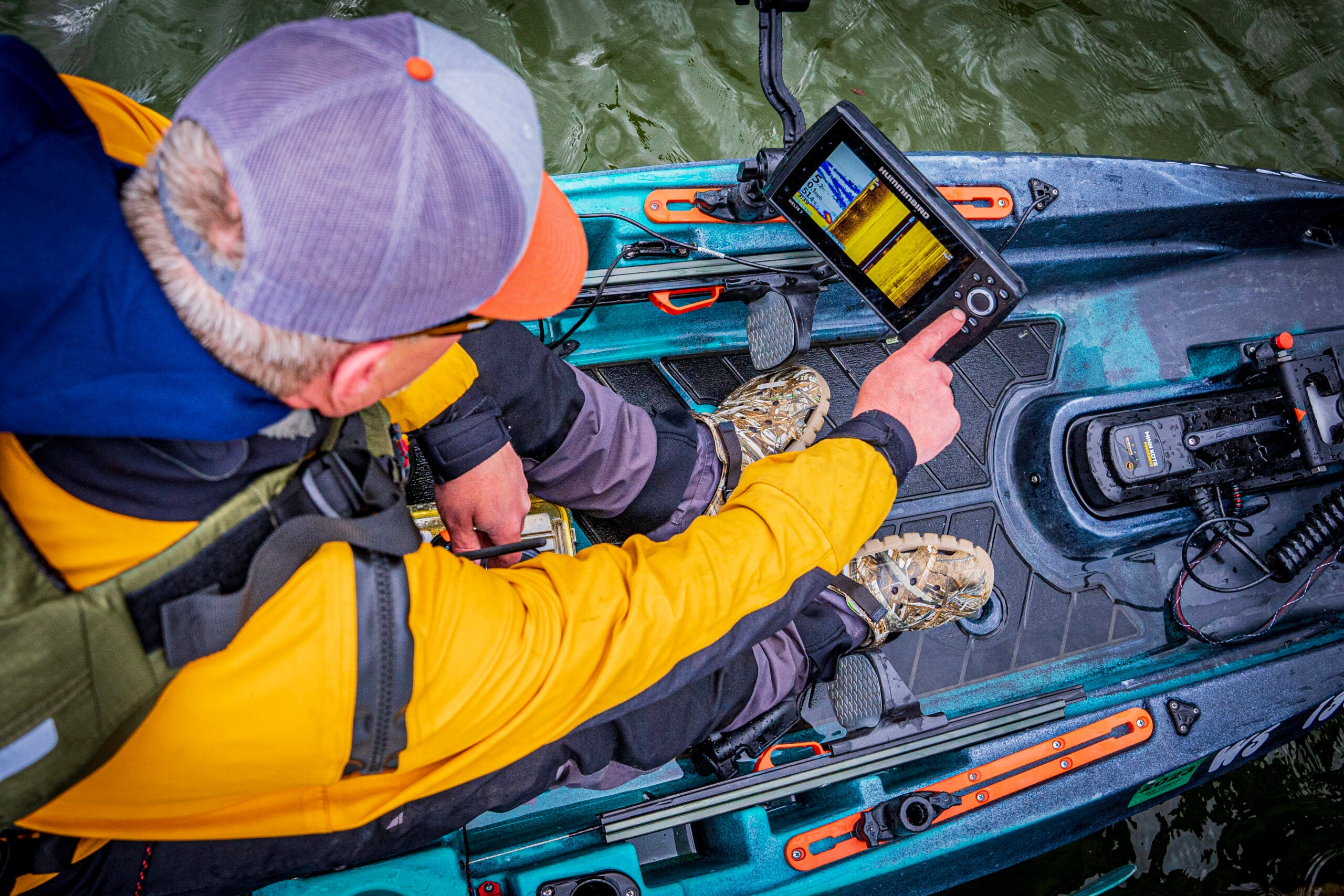 Kayaker using fish finder