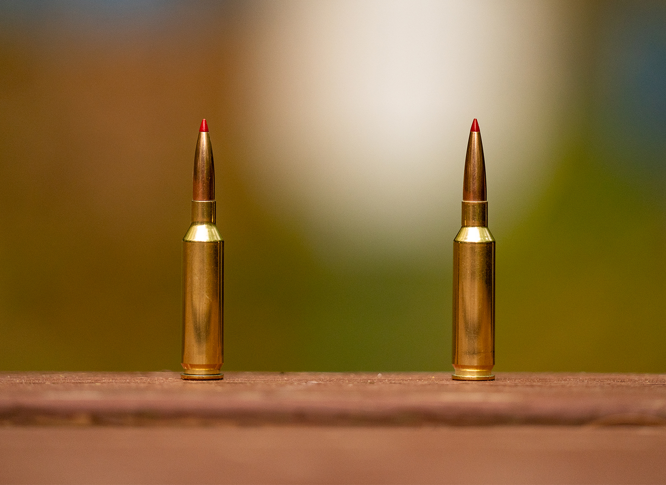 6mm Creedmoor vs 25 Creedmoor, both cartridges standing on a table.