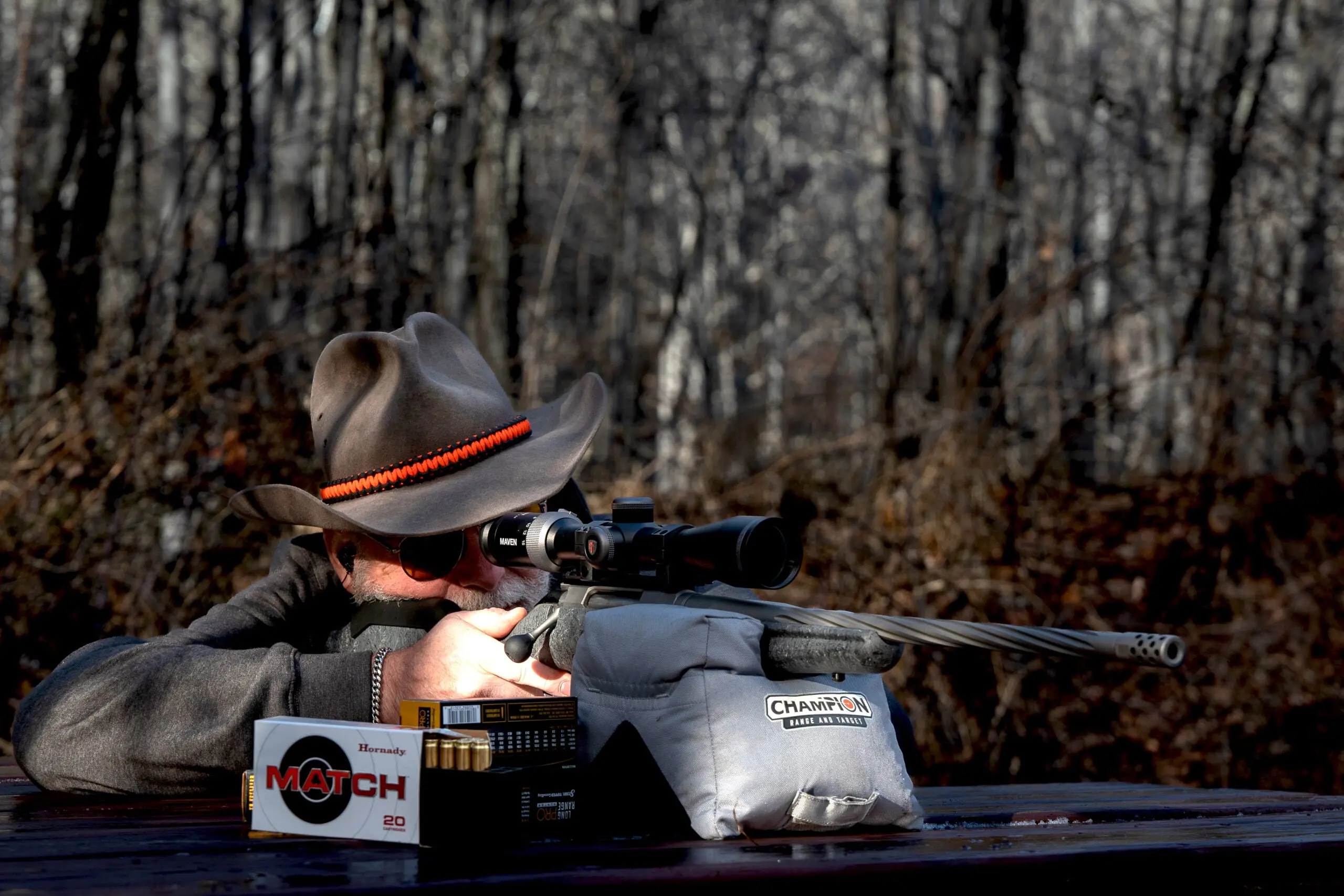 Shooter fires the Ruger American Gen II rifle from a bench