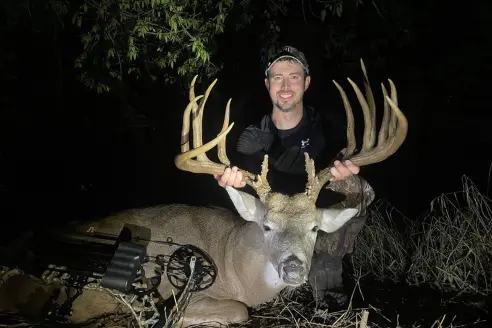 An Oklahoma bowhunter poses with a trophy whitetail. 